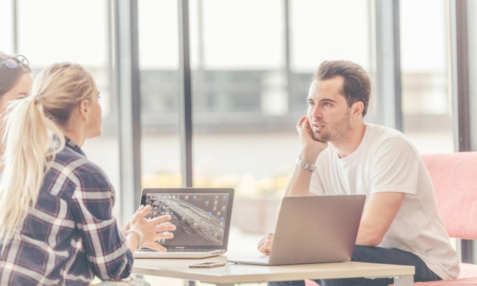 Business team analyzing financial allocation charts and strategic planning documents